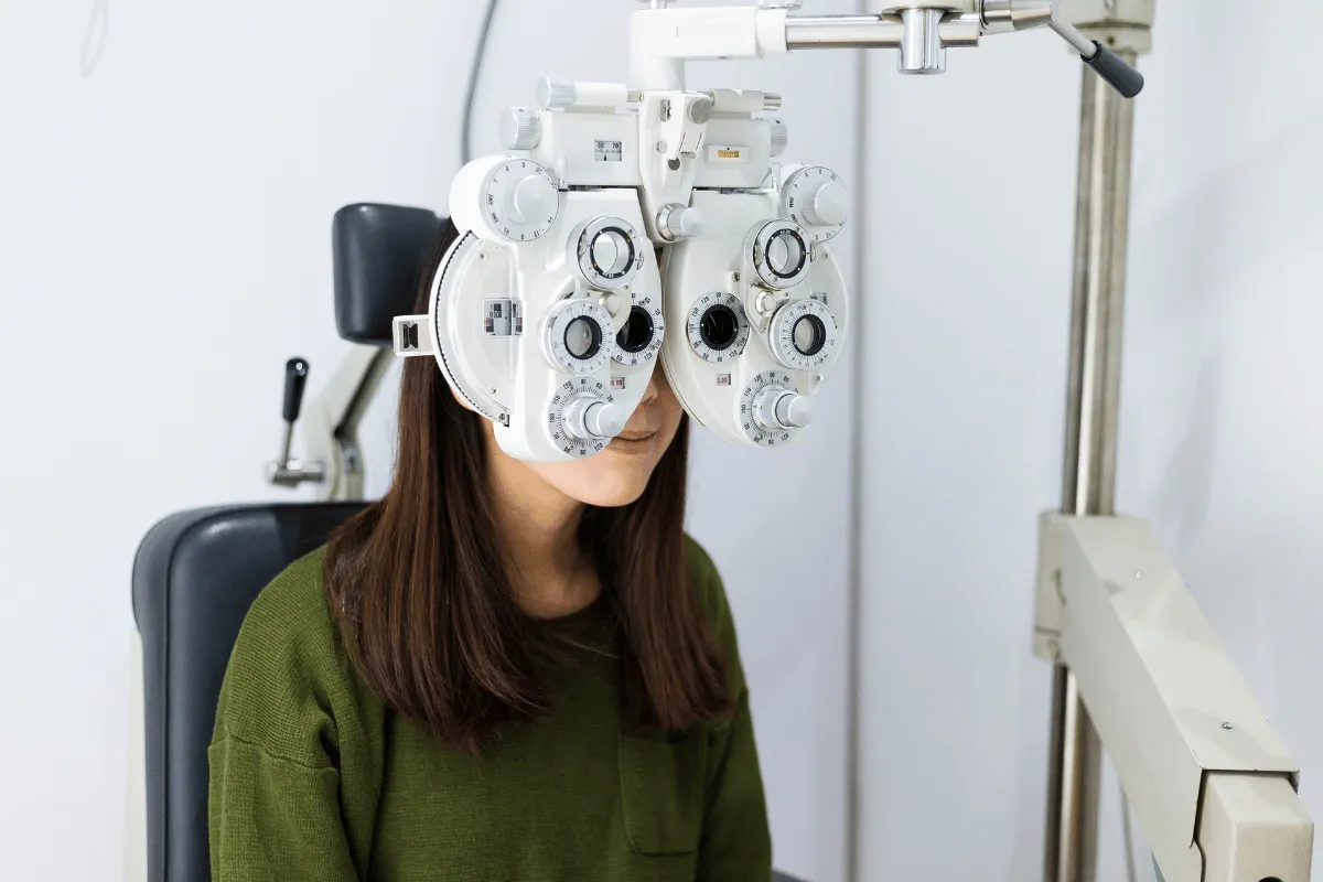 a woman getting an eye exam at the eye doctor's