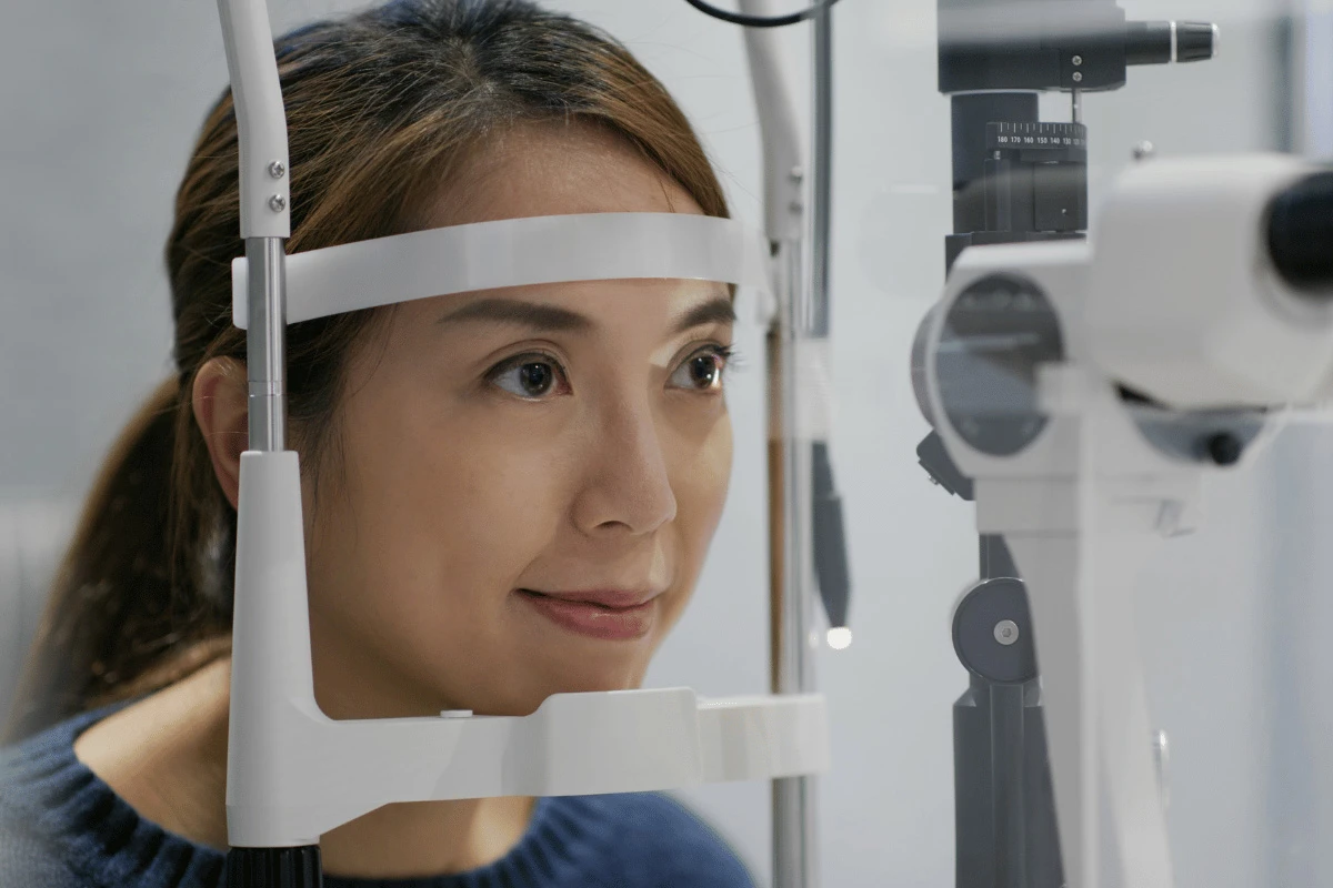 a woman getting a comprehensive eye exam